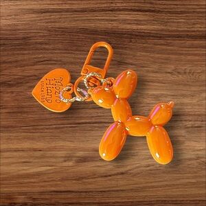 Bright Orange Balloon Dog Keychain with Heart Charm.